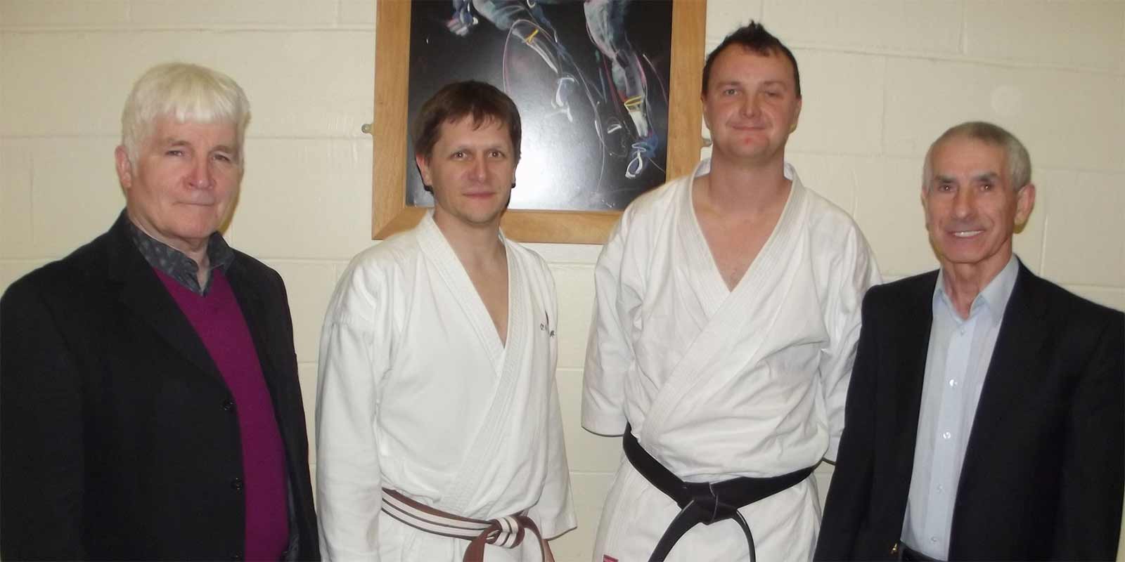 Sensei Dan Salter after achieving his black belt under Sensei Bob Rhodes (left) and Sensei Andy Sherry (right)
